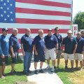 Posing for a photo are past and present firemen including Brahm Rossiter, Ted Schlosser, John Gibson, Norman Garcia, Don Steele, Kyle Reed, David Corbridge, Rick Borba and John Paz.